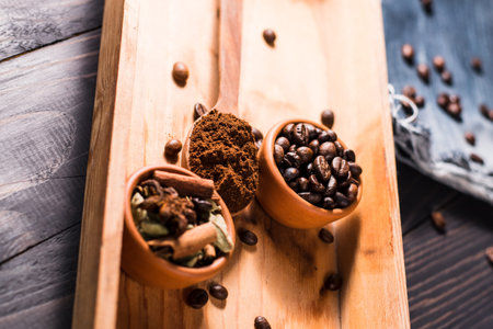 Plate of coffee beans.a bowl of coffee spilled.Very tasty roasted coffee beans. Photo of coffee from...