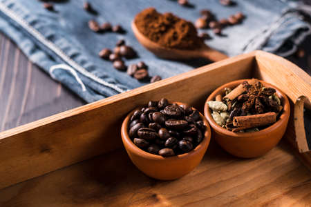 Plate of coffee beans.a bowl of coffee spilled.Very tasty roasted coffee beans. Photo of coffee from above.の写真素材