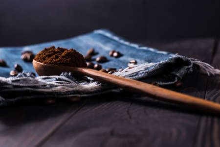 Plate of coffee beans.a bowl of coffee spilled.Very tasty roasted coffee beans. Photo of coffee from above.の写真素材