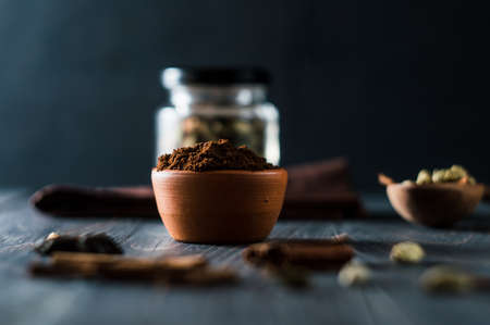 Cocoa powder in a bowl on wooden background with copy spaceの写真素材