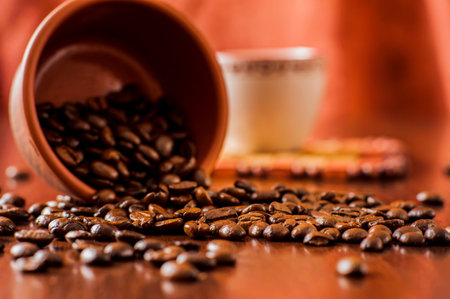 Background of ground coffee texture. Coffee beans are scon wooden table. attered on the table.Packaging for coffee.Closeup of coffee beans background.coffee beansの写真素材