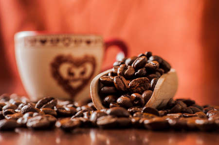Background of ground coffee texture. Coffee beans are scon wooden table. attered on the table.Packaging for coffee.Closeup of coffee beans background.coffee beansの写真素材