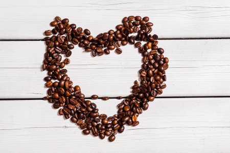 A scoop of fresh coffee beans.