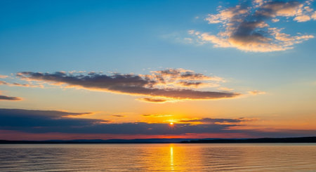 Beautiful sunset over the lake. Panoramic view of the lake.