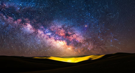 Milky way over sand dunes.の写真素材