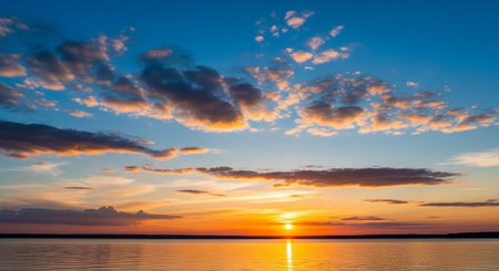Beautiful sunset on the lake. Beautiful sky with clouds at sunset.の写真素材