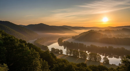 Foggy sunrise over the river. Panoramic landscape.