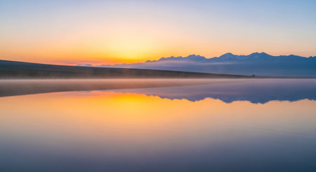 Panoramic view of lake and mountains in the background at sunrise