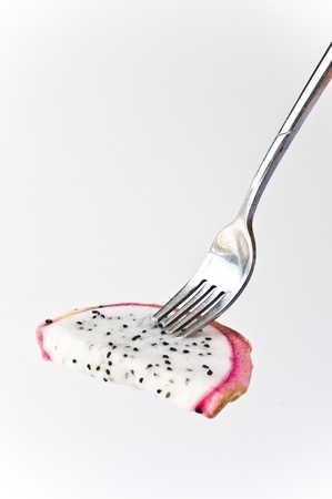 Dragon fruit on a fork の写真素材