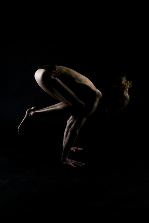 Young man practicing yogaの写真素材