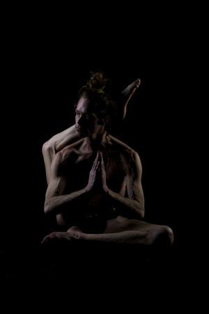 Young man practicing yogaの写真素材