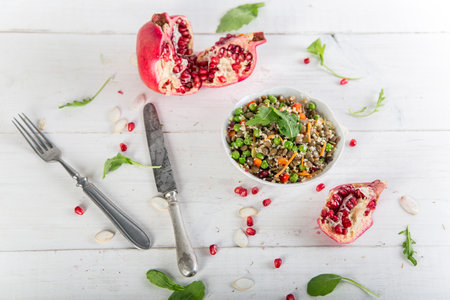 Healthy salad with cilantro beans and other ingredients. Lean vegetarian. White wood background.の写真素材