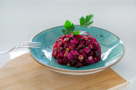 Vinaigrette salad with boiled vegetables, pickled cucumbers, sauerkraut and canned greens isolated...