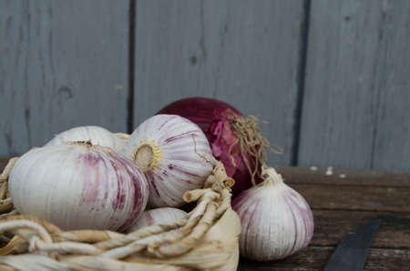 garlic in a basketの写真素材