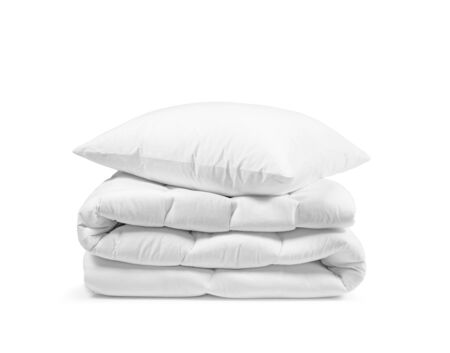 Stack of beddings on the white background, white pillow on the duvet isolated, bedding objects isolated against white background, bedding mockupの写真素材