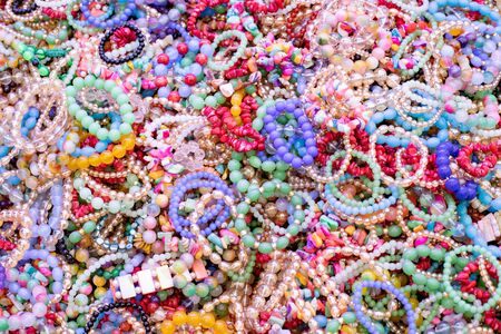 Assortment collection of women's colorful necklaces. Colorfull background from bijouterie.の写真素材
