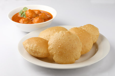 Indian food Puri Bhaji. North India. Puri is a deep fried bread made from whole wheat flour Served with Potato currybhaji or alu ki sabji.or Potato curry or dum alu curryの写真素材