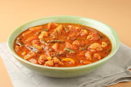 Mix vegetable curry - Indian main course recipe contains Carrots, cauliflower, green peas and beans, baby corn, capsicumの写真素材