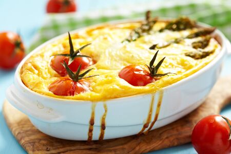 quiche with asparagus and tomatoの写真素材