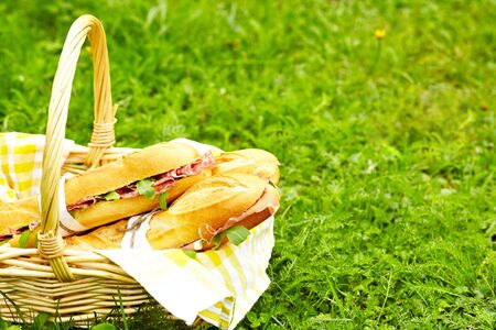 Long baguette sandwiches in basketの写真素材