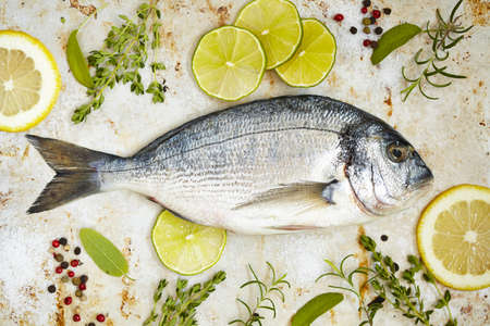 Fresh sea bream with lemon, lime and herbs