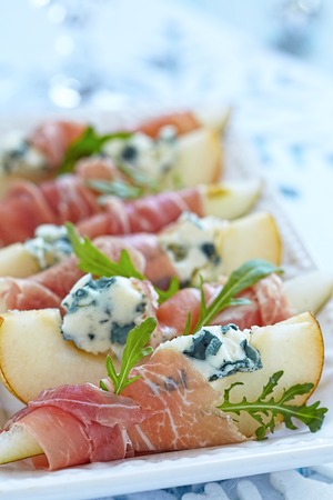 Appetizer with pear, prosciutto and blue cheese for holidaysの写真素材