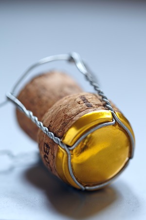 champagne or sparking wine cork on silver backgroundの写真素材