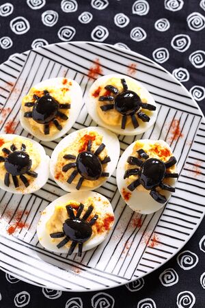 Deviled eggs with a Spider for Halloweenの写真素材