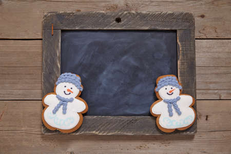 Christmas decoration with chalkboard and gingerbread snowmanの写真素材