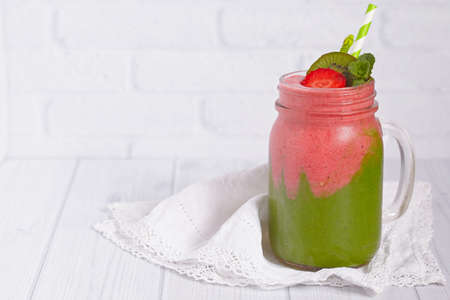 Mason jar of greens and strawberry smoothieの写真素材