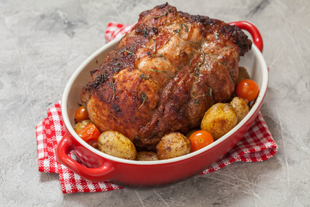 Boneless Pork Loin Roast with Potatoes and Tomatoesの写真素材