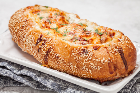 Baked white fish casserole in a bread bowlの写真素材