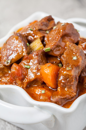 Beef stew with beer, rosemary and vegetablesの写真素材