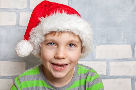 Cute Little boy with a Santa hatの写真素材