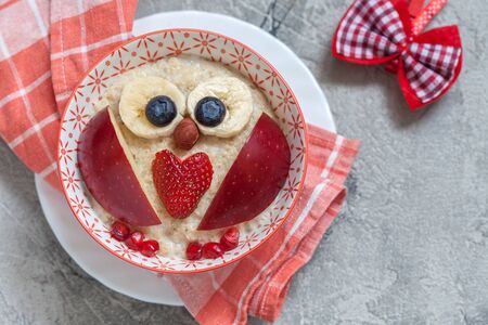Kids breakfast porridge with fruits and nutsの写真素材