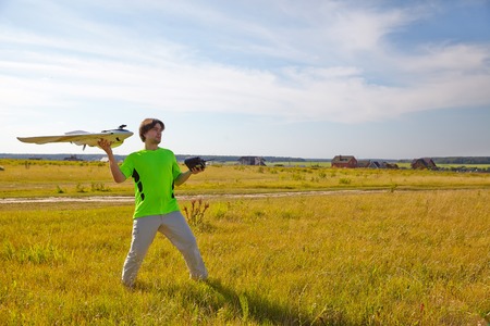 Remote control for quadrocopter, close-up. Transmitter for controlling moving device in male hands,...