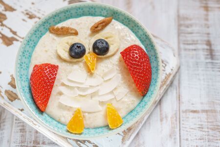 Kids breakfast porridge with fruits and nutsの写真素材