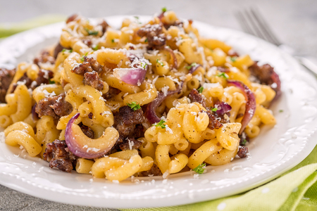 tasty cellentani pasta with meat sauceの写真素材