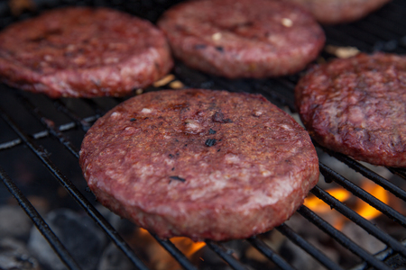 Beef or pork meat barbecue burgers for hamburger prepared grilled on flame grillの写真素材