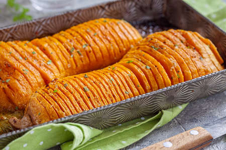 Roasted hasselback butternut squash pumpkinの写真素材
