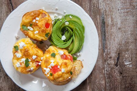 Delicious egg muffins with ham, cheese and vegetablesの写真素材