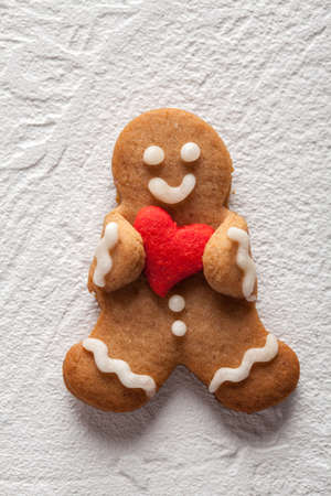 Cute ingerbread man with heart decoration