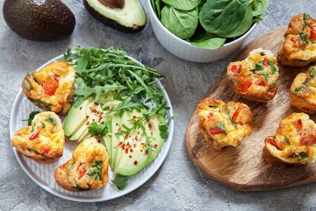 Delicious egg muffins with ham, cheese and vegetablesの写真素材