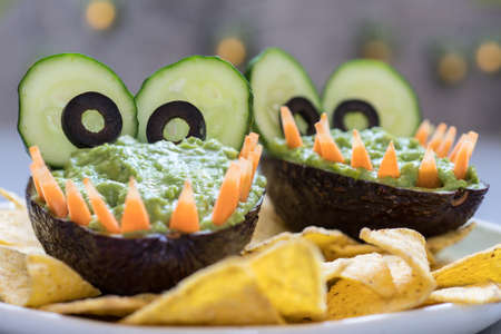 Funny alligator avocado guacamole dip and nachos