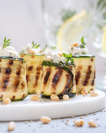 Grilled zucchini rolls stuffed with cream cheeseの写真素材