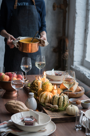 Autumn table setting with pumpkins. Thanksgiving dinner and fall decoration.の写真素材