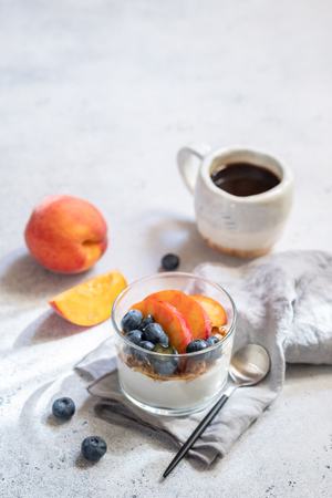Granola muesli and yogurt with fresh berries and fruitの写真素材