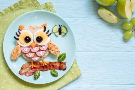 Cute little owl sandwich toast with sausages and eggsの写真素材