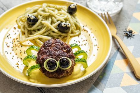 Cutlet spider with pesto pastaの写真素材