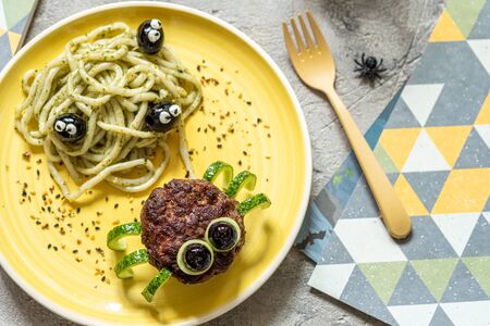 Cutlet spider with pesto pastaの写真素材